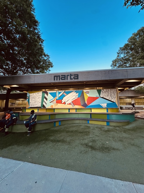 Arts Center Station — mural and stepped seating